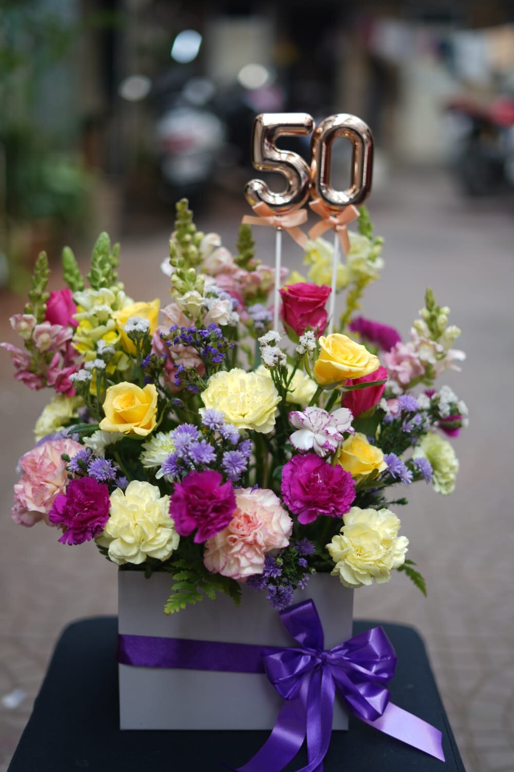 50th anniversary purple orchid and roses vase arrangement