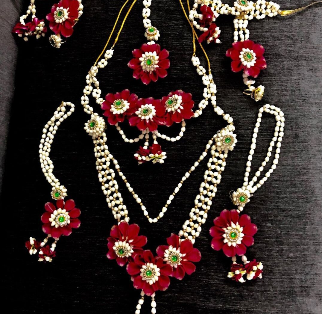 Handcrafted floral jewellery set with red and white flowers