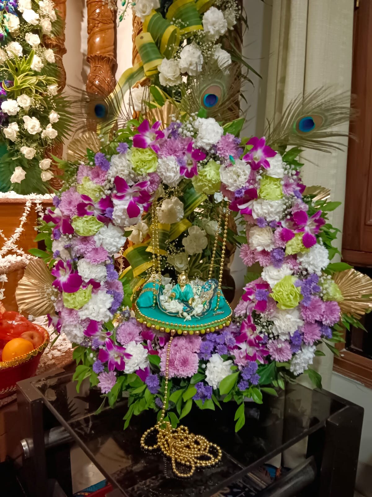 Large decorative floral basket with mixed flowers for outdoor event