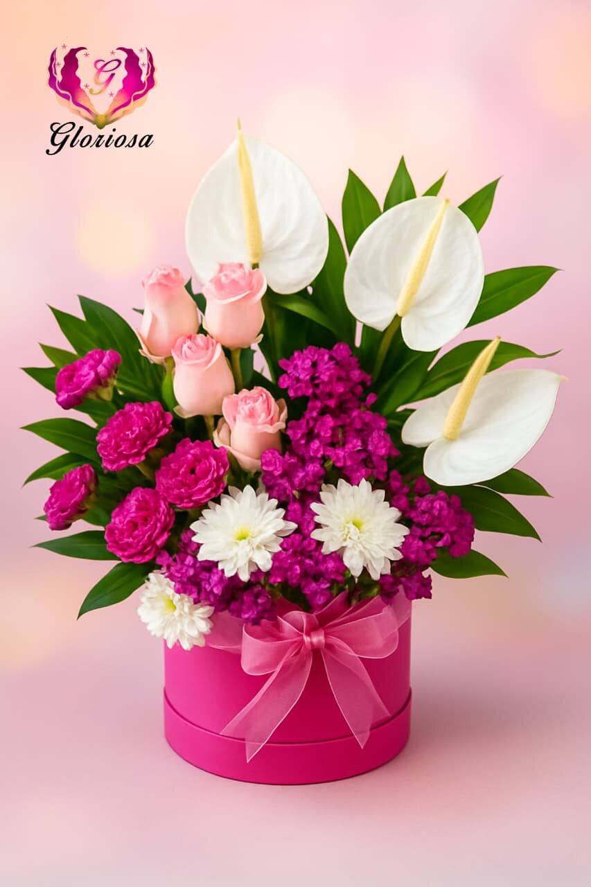 Pink anthurium and roses arrangement in fuchsia hat box