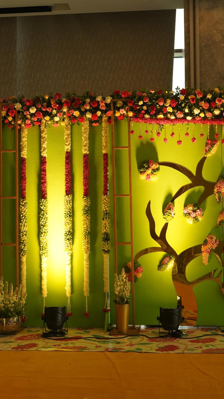 Wedding stage decoration with vibrant floral garlands