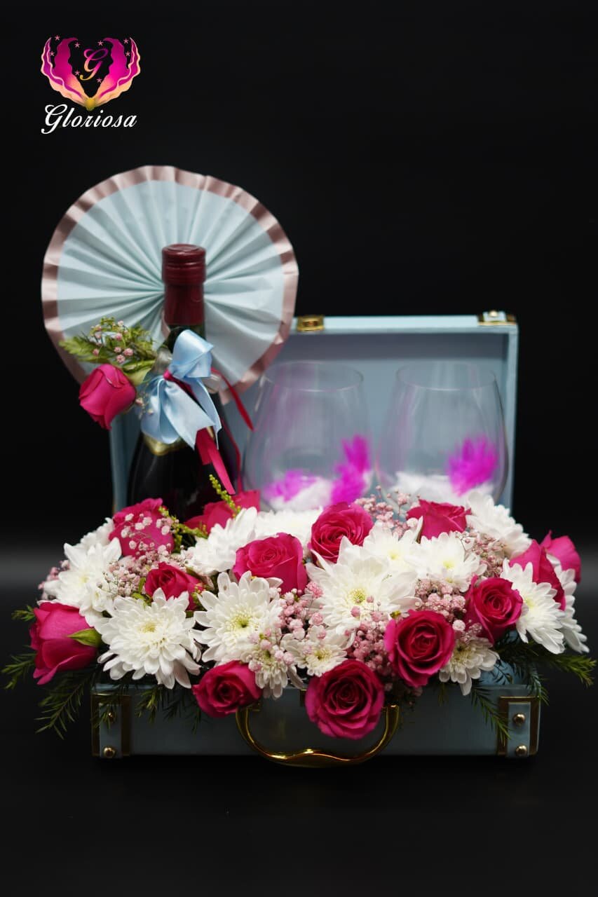 Wine and roses luxury gift hamper in vintage suitcase